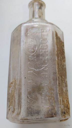 Бутылка ПМВ с надписями колокольный переулок Кельн  и остатками родной этикетки  смотрите описание