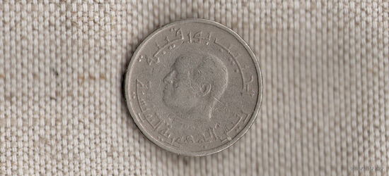 Тунис 1/2  пол 0,5 динара 1983 /голова//(Sx)