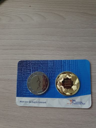 Монета Нидерланды 2 евро 2022 Медицинские работники 2 Евро регулярная + жетон BU БЛИСТЕР